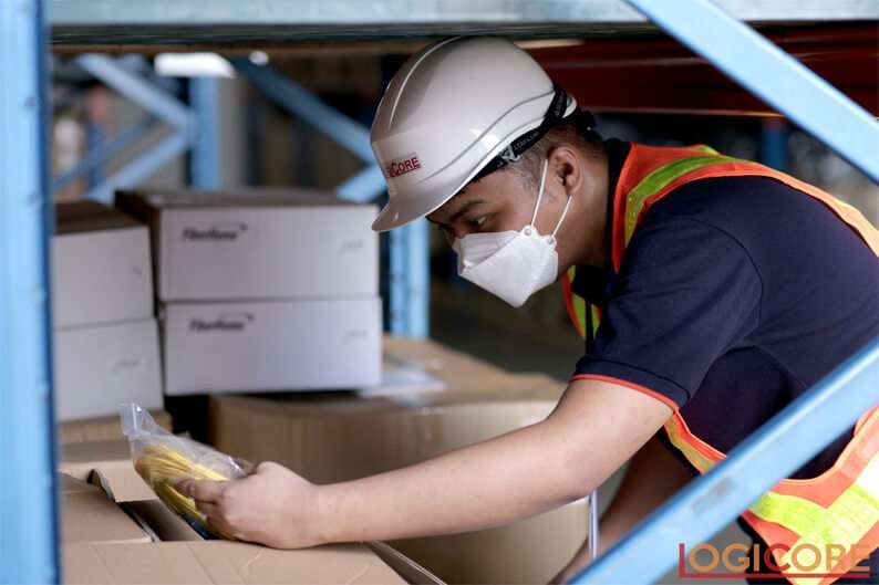 Man wearing safety vest and Helmet in Logicore Warehouse