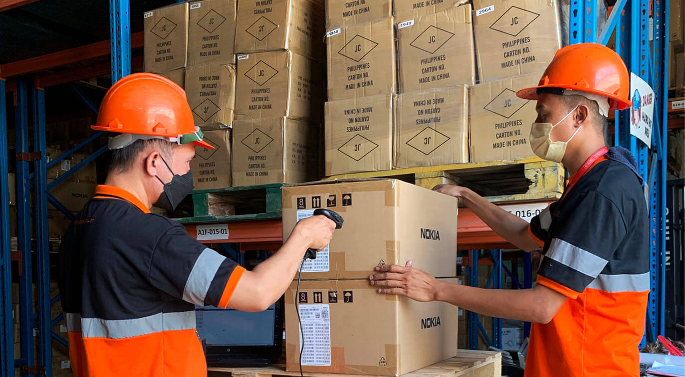 two warehouse man scanning item for inventory